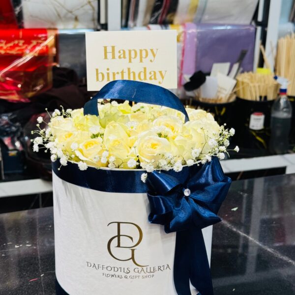 Cream Rose Box Arrangement with Navy Blue Ribbon