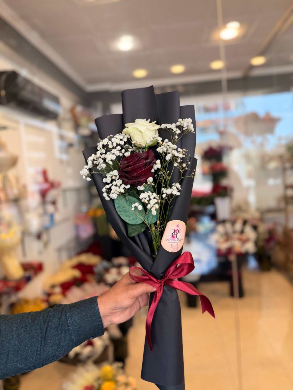 3083464a-c410-4699-8143-cce4927f64d3 (1) Elegant Red & White Rose Duo in Black Wrap - Image 1