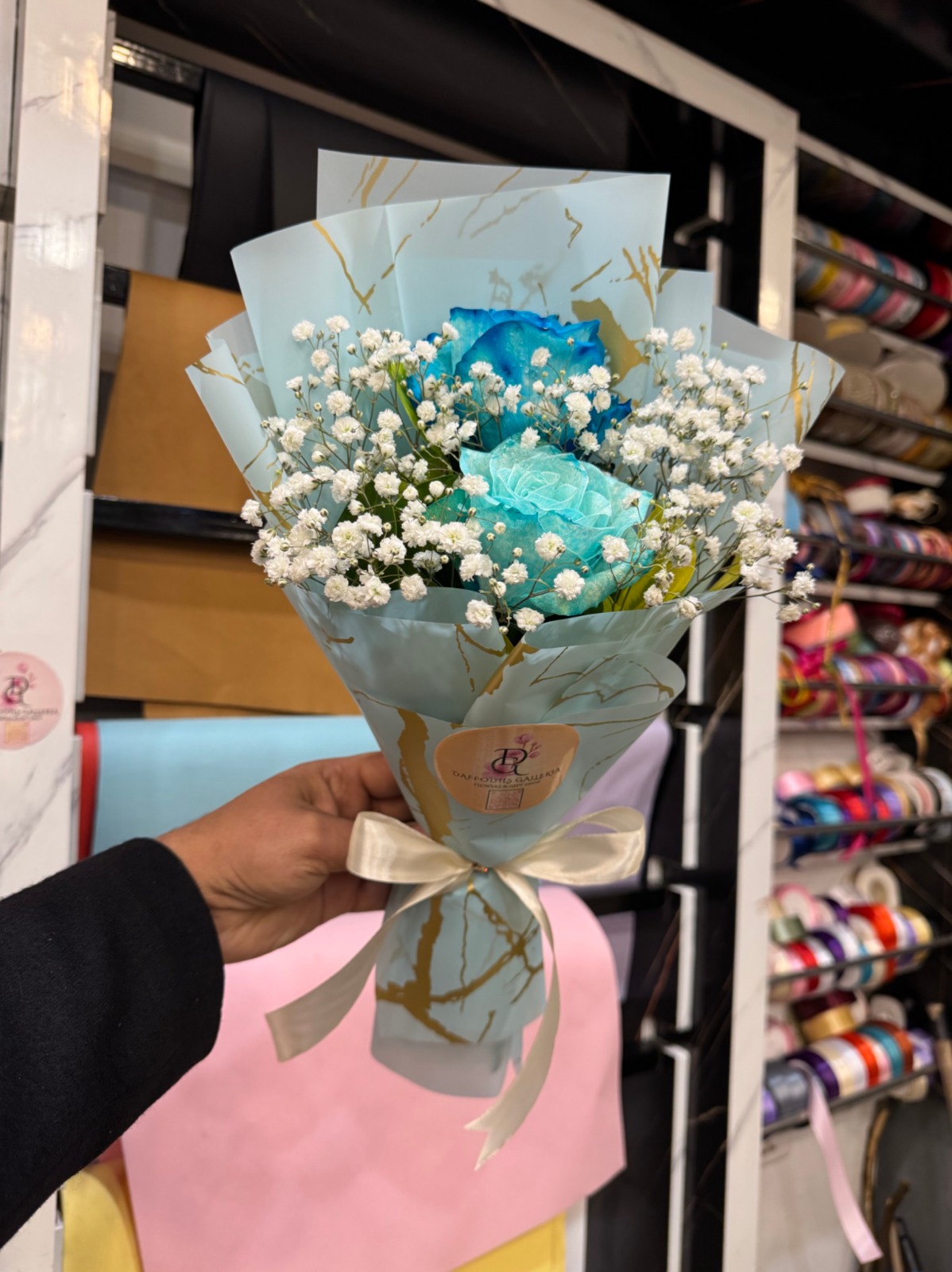 c9e52340-d1a5-4373-8be8-4698d83a8ef6 Electric Blue & Mint Rose Duo with Baby’s Breath - Image 1